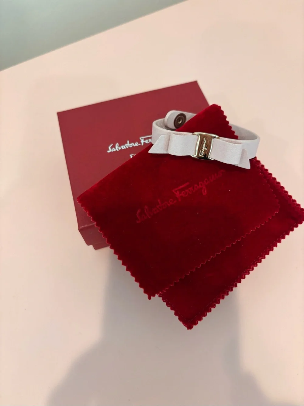 Salvatore Ferragamo Pale Pink Leather Vara Bow Bracelet with Gold Hardware
